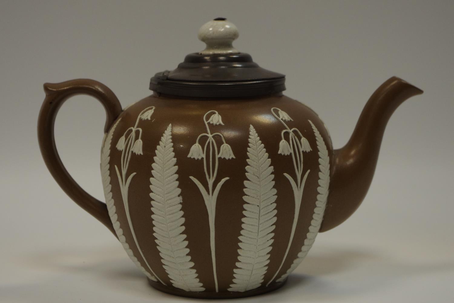 A Victorian globular stoneware teapot, in the manner of Adams,