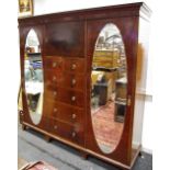 A Walter Carte (Harrod's Ltd) Manchester flame mahogany compactum,