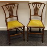 A pair of Edwardian Sheraton Revival bedroom chairs,