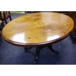 A Victorian walnut breakfast table oval top quarter veneered inlaid with flora,