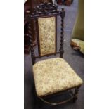 A 19th century hall chair,pierced and shaped pediment, barley twist uprights, padded back and seat,