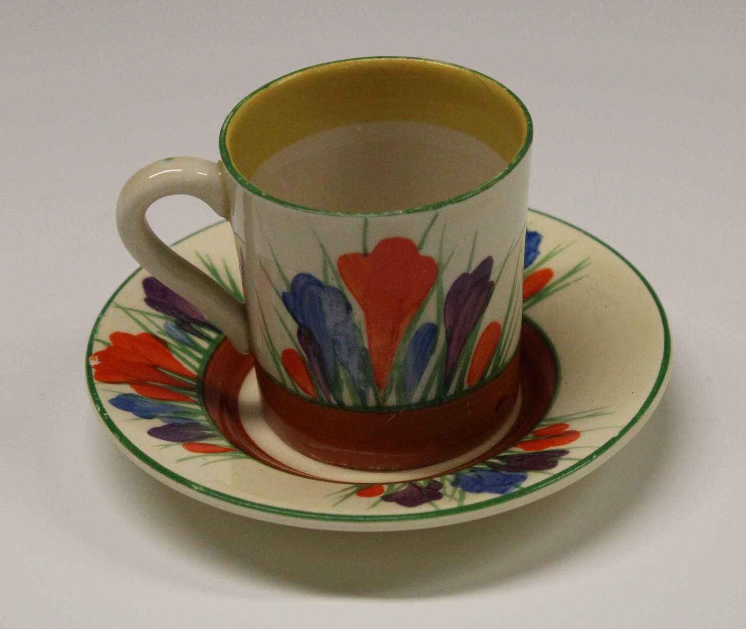 A Clarice Cliff Crocus coffee cup and saucer, decorated with orange, blue and purple flowers, - Image 2 of 5