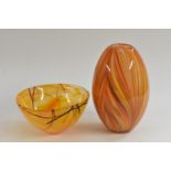 A Kosta Boda Contrast pattern bowl, designed by Anna Ehrner, in vivid shades of orange,