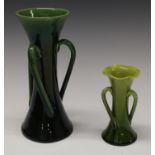 A Bretby waisted cylindrical three handled vase, in tones of green, 21.