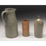 Joanna Constantinidis (1927-2000) - a spreading cylindrical jug, in mottled grey glaze, 31.
