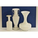 A white cased glass tall slender two handled pedestal vase,