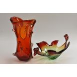 A large Murano glass studio vase, in red with three open ovals and pinched sides,