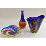 A large art glass handkerchief vase, in vivid shades of blue, orange and green,