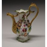 A Rockingham type novelty miniature coffee pot, encrusted with flowers, 16cm high, c.