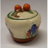 A Clarice Cliff Crocus pattern waisted preserve pot and cover, painted in colours with crocuses,