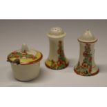 A Clarice Cliff Sunshine pattern three piece condiment set, decorated with hollyhocks,