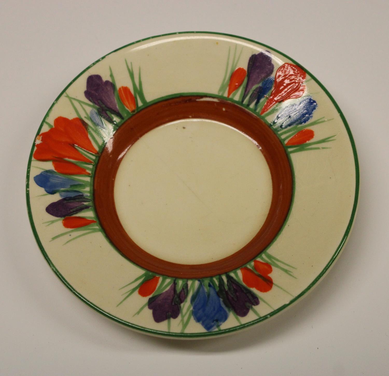 A Clarice Cliff Crocus coffee cup and saucer, decorated with orange, blue and purple flowers, - Image 5 of 5