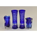 A pair of Bohemian blue overlay waisted cylindrical vases, 26.