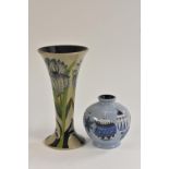 A contemporary Moorcroft Green Iris pattern slender tapering cylindrical vase,