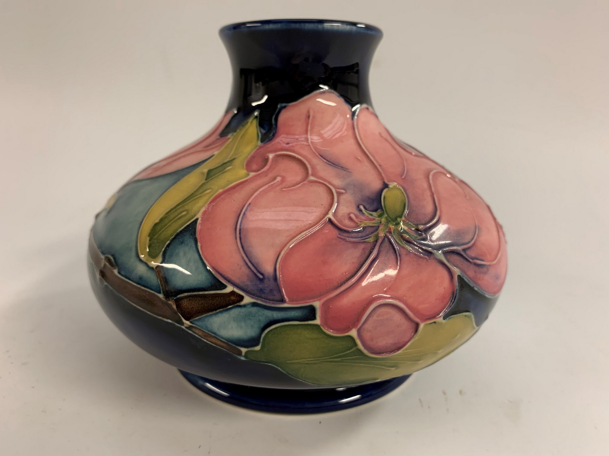 A Moorcroft Magnolia pattern compressed ovoid vase,