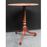 A Regency style mahogany tripod occasional table, elliptical top, turned column,