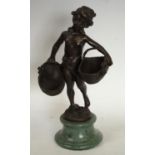 After the French School, a brown patinated bronze, of a scantily clad young girl carrying baskets,