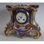A 19th century Paris porcelain cartouche shaped mantel clock, white enamel dial inscribed J.