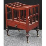 A George III mahogany Canterbury, of small proportions, three divisions, apron drawer, casters,