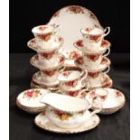 A Royal Albert Old Country Roses dinner and teaware including dinner and side plates, cups, saucers,