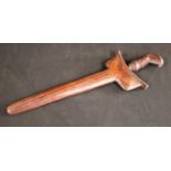 An Malay Indonesian kris, 23cm wavy blade, hardood stylised lotus handle, hardwood scabbard,