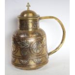 A Middle Eastern silver and copper damascened brass flagon,