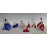 Five Royal Doulton figures; two others,