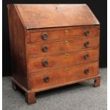 A George III oak bureau, fall front enclosing a small door, small drawers and pigeonholes,