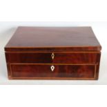 A George III mahogany rectangular work box, hinged cover enclosing an arrangement of compartments,