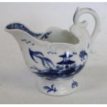 A Derby low ewer, painted in underglaze blue with a two story hut on an island,