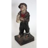 Advertising - a Qualcast cast iron figure, cast as a young boy selling newspapers,