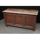 A 17th century oak blanket chest, hinged top enclosing an open candle box/till,