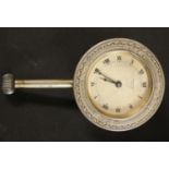 Automobilia - an early 20th century dashboard clock, the silvered dial inscribed Waltham,
