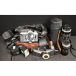 Cameras - a vintager Olympus OM2 slr camera body, assorted lenses inc Hoya 75-260mm, Hanimex 105MM,