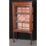 An Edwardian inlaid mahogany single door display cabinet, 133.