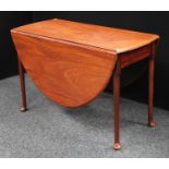 A George III mahogany gateleg dining table, elliptical top with fall leaves,