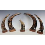 A pair carved chinese horns depicting dragons,