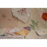 A quantity of table linen embroidered,