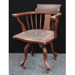 A Victorian smoker's bow type swivel desk chair,