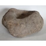 A Medieval granite quern stone/mortar,