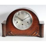 An Art Deco oak cased mantel clock, 8 day chiming movement,