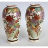 A pair of Japanese Satsuma ovoid vases, decorated overall with fanciful birds and wisteria, 15.