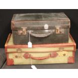 A vintage canvas and leather suitcase; another, similar,