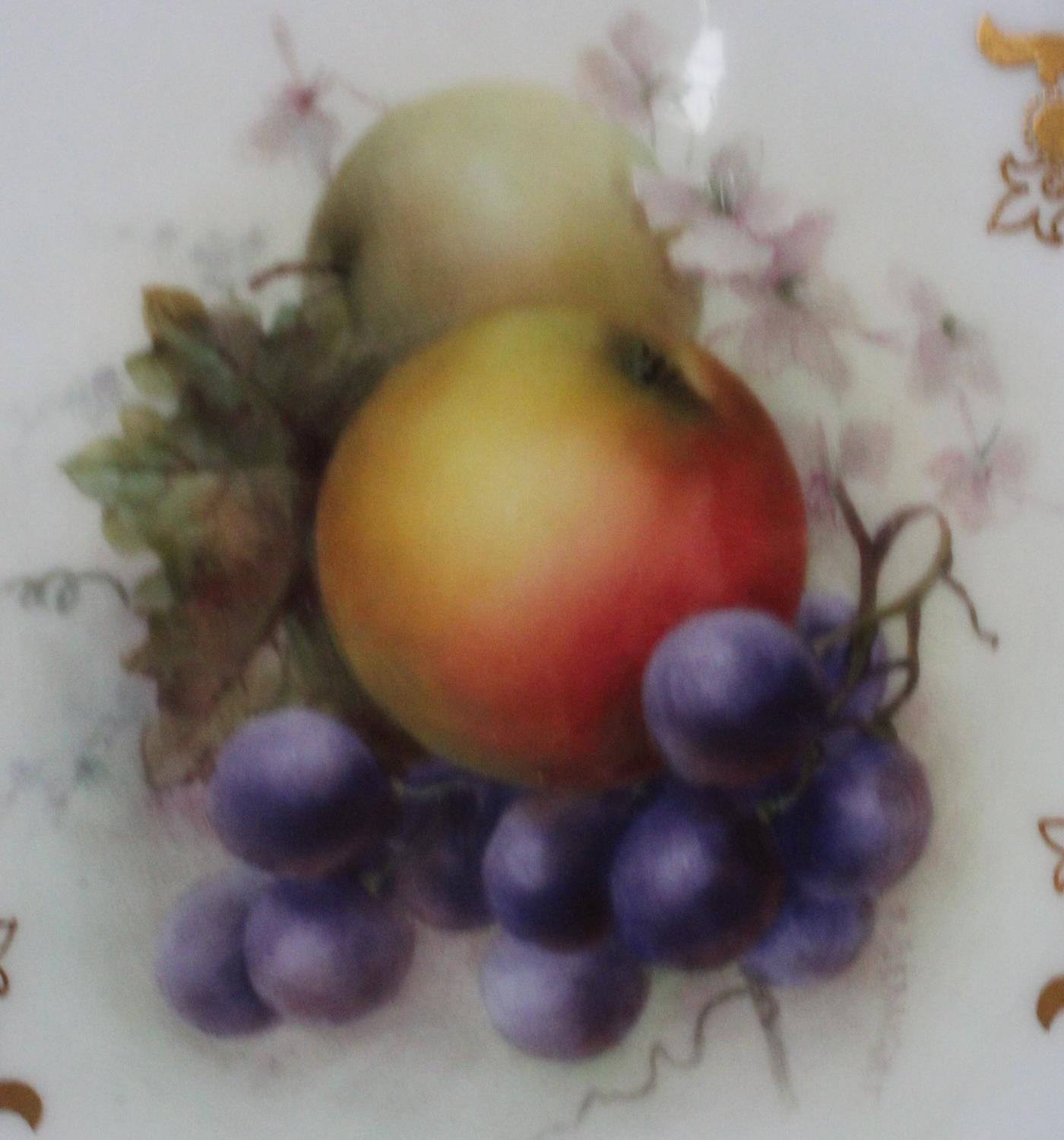 An early 20th century Royal Worcester shaped circular cabinet plate, the central painted with fruit, - Image 2 of 2
