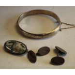 A silver bangle; agate and silver brooch;