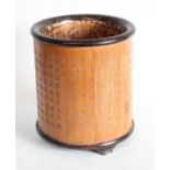 A Chinese two-tone bamboo bitong brush pot, profusely carved in shallow relief with script,