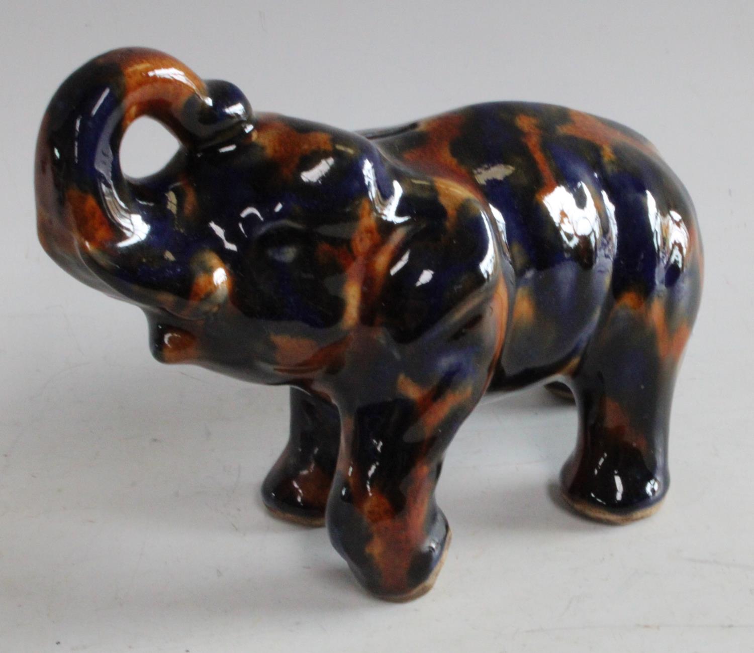 An early/mid 20th century Denby Majolica piggy bank as an Elephant,