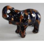 An early/mid 20th century Denby Majolica piggy bank as an Elephant,