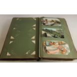 A postcard album, including silks, topographical, advertising, photographic,