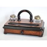 A Victorian walnut and ebonised inkstand, drawer to base, c.